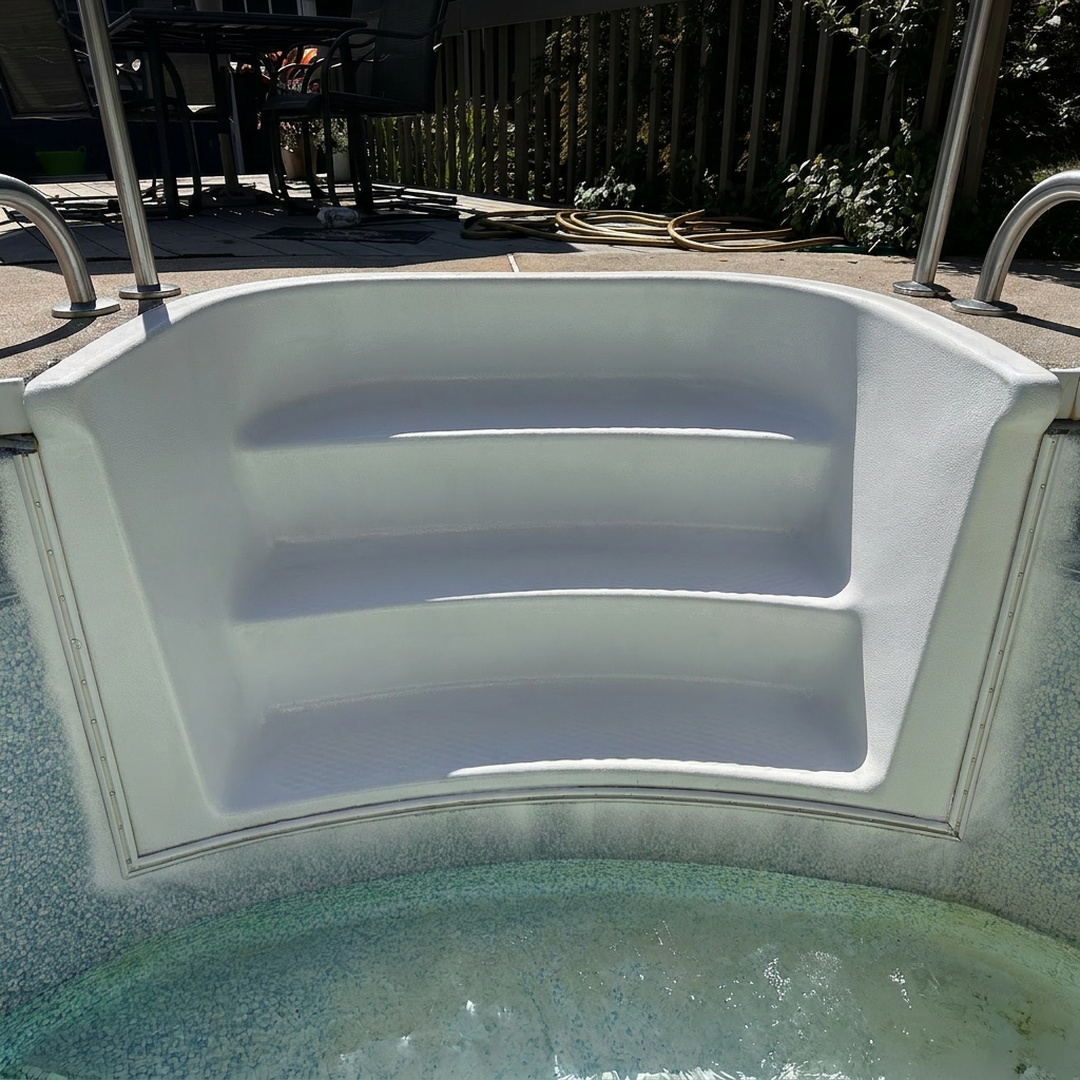Refinished fiberglass pool steps after repair