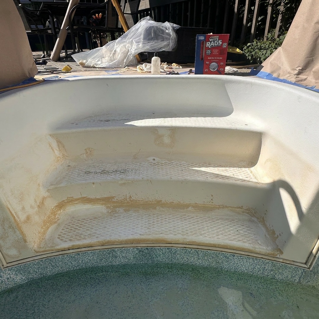 Damaged fiberglass pool steps before repair